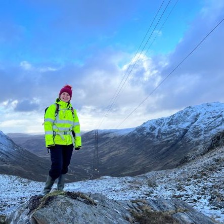 Photo of woman standing in snowy surroundings