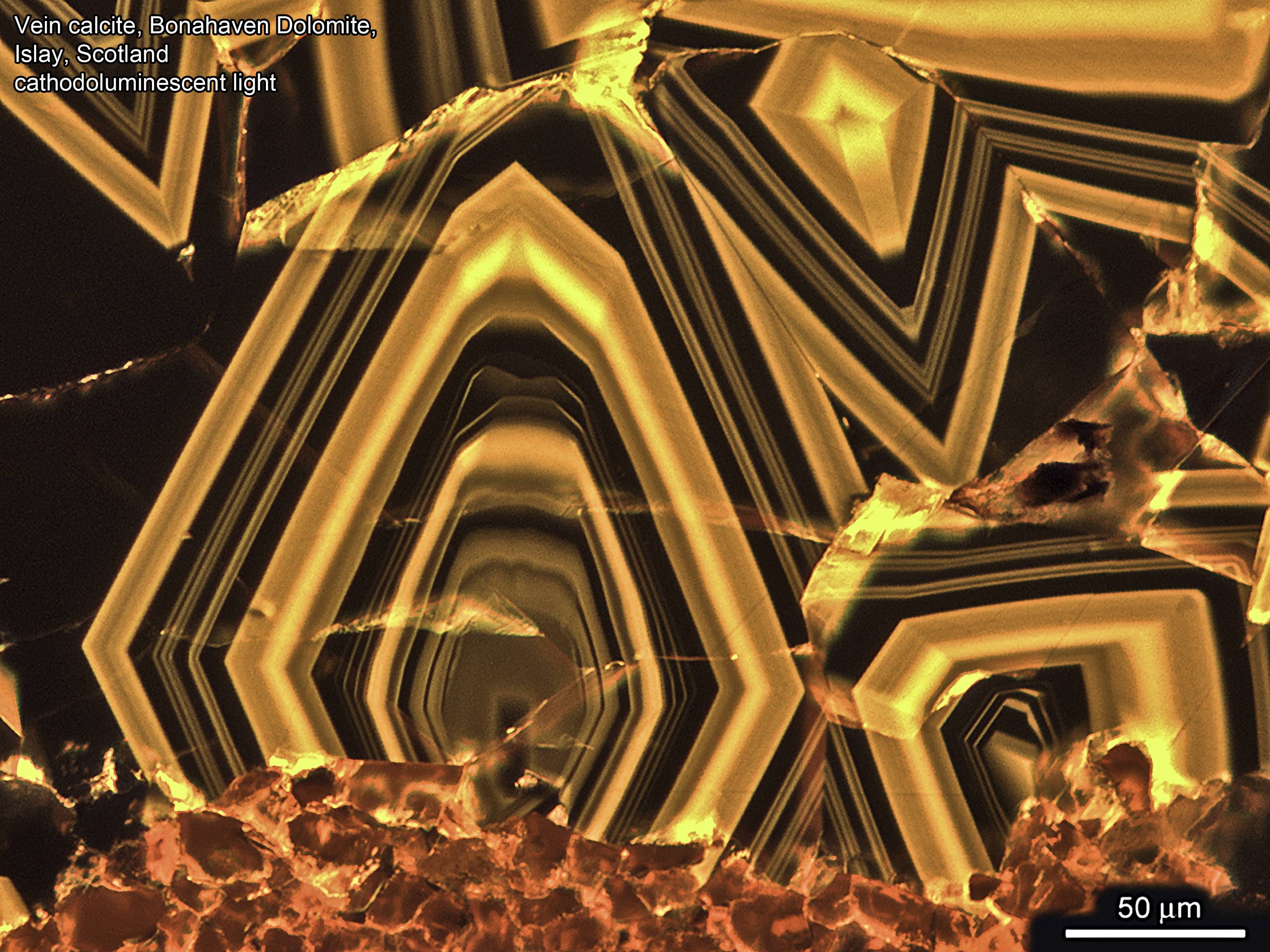 Thin section cathodoluminescence image, zoned calcite cement growing centripetally into a small vein, Bonahaven Dolomite, Dalradian, Islay, Scotland. 