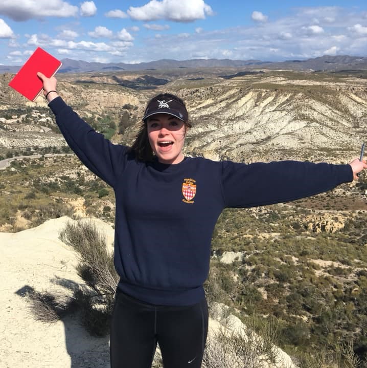 Photo of woman outside with arms streched out