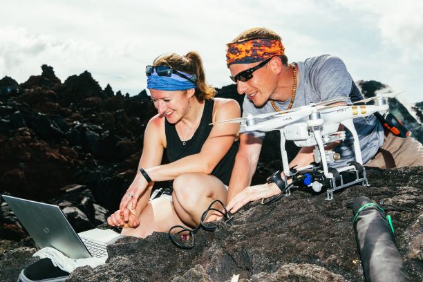 Dr Emma Liu and Dr Kieran Wood take a look at the new data after a drone returns. Image credit Matthew Wordell