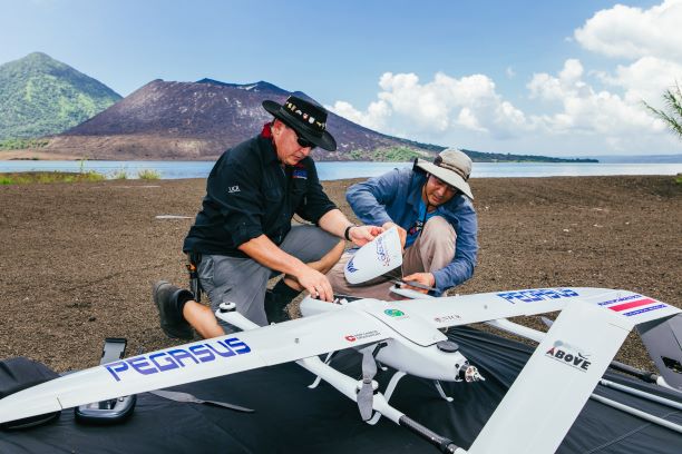 Two scientists preparing a drone for take-off; image credit Matthew Wordell / Emma Liu, UCL