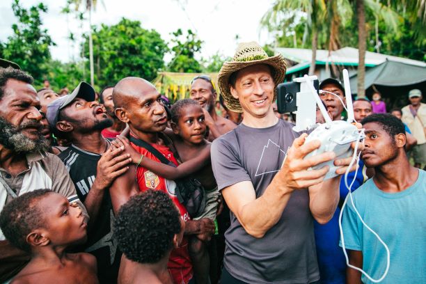 Dr Scott Nowicki demonstrates the drone flight controls to an interested audience from the community; image credit Matthew Wordell