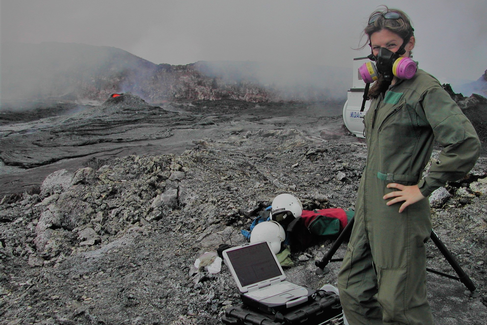 Professor Marie Edmonds monitoring eruption gases at the summit of an active volcano
