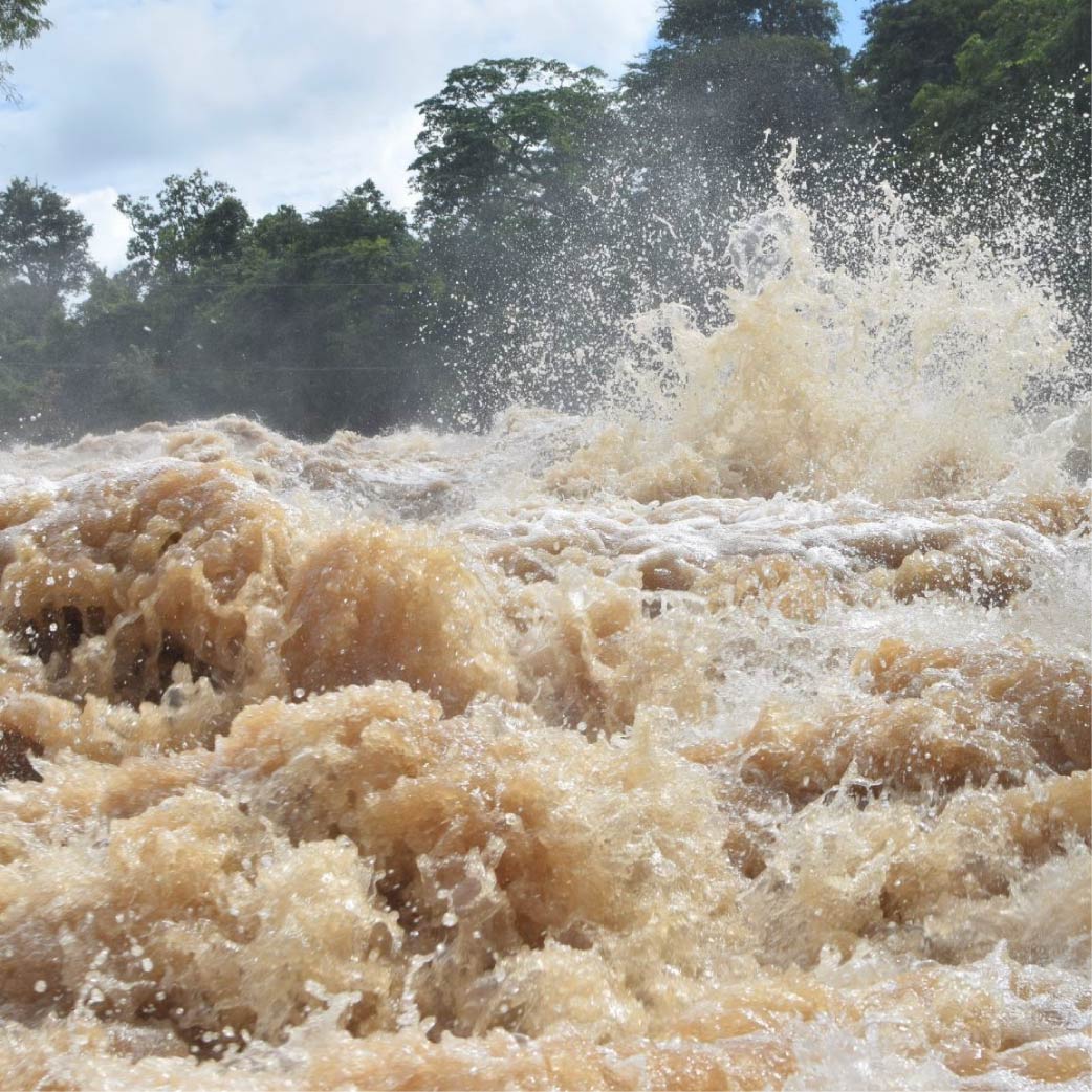 Photo of muddy fast flowing river