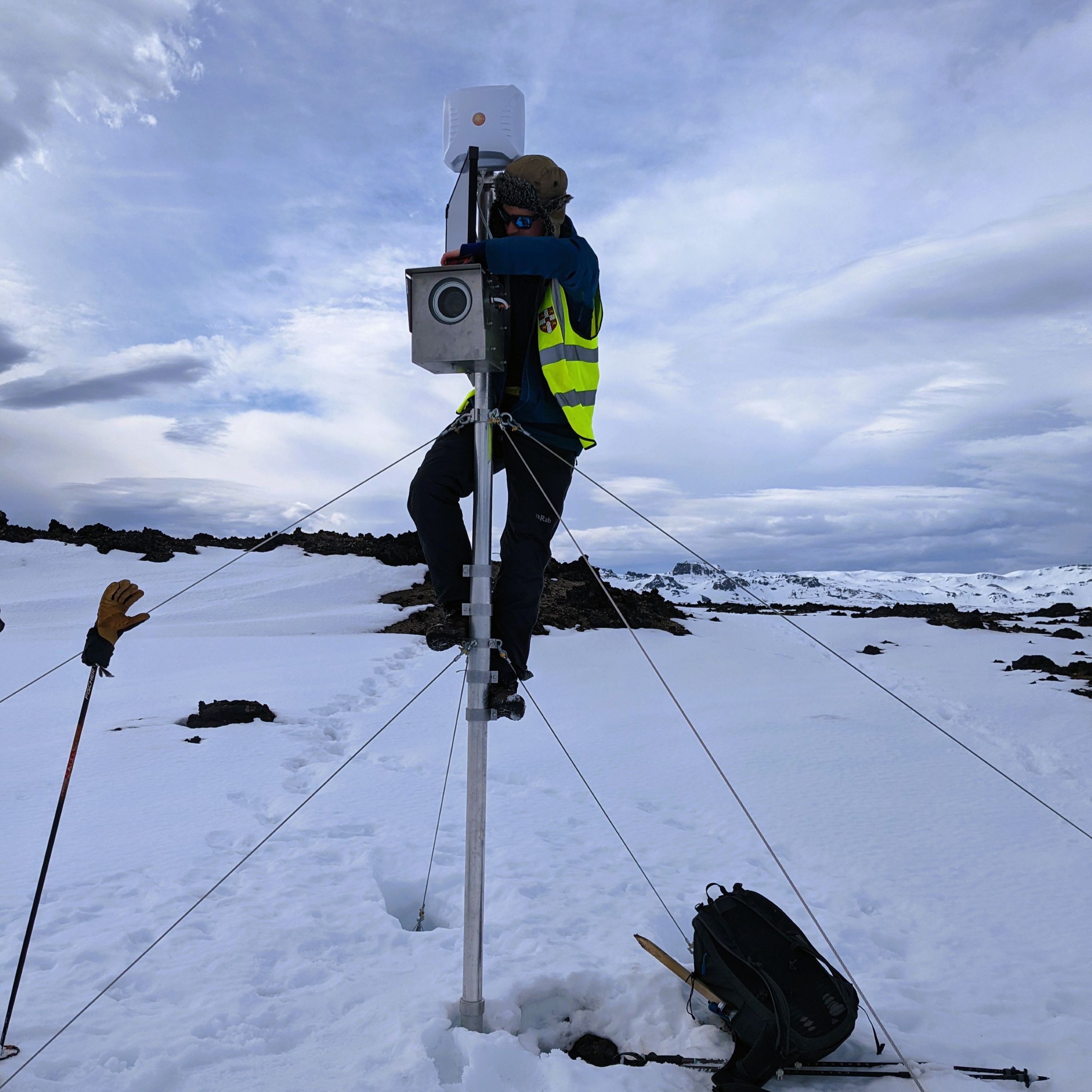 Seismologist setting up monitoring equipment in Iceland