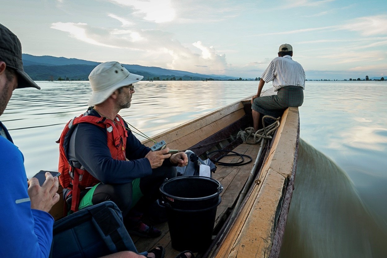 Sampling on the Irrawaddy River, credit Vivien Cumming Photo of scientists sampling from a boat on the Irrawaddy River