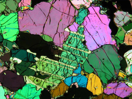 LA-ICP-MS craters in diopside from a spinel peridotite, Antarctic Peninsula. Each crater has a diameter of ~80 microns