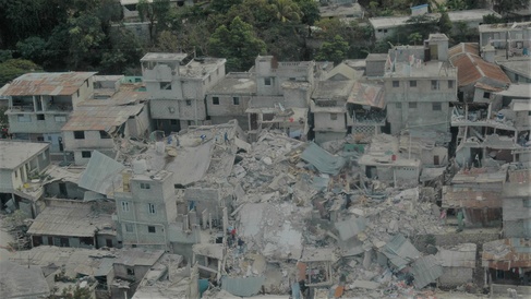 Image showing people standing amid the rubble of destroyed building