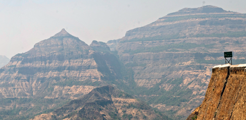 Image showing the profile of the Deccan Traps volcanic province in India - the rocks are horizontally striped with alternate light, dark layers of lava