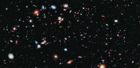 Image of our galaxy, showing colourful and distant planets and stars