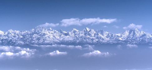 Image of the Himalayan mountains above the clouds 