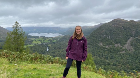 Photo of Natalie Forrest with green hills behind