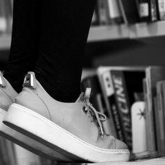 Photo of stool reaching books in library