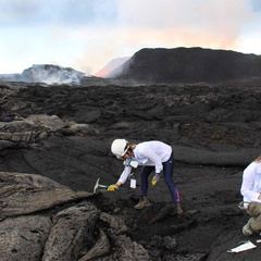 Image of Dr Penny Wieser sampling the Kilauea lavas