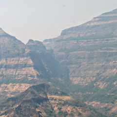 Image showing the profile of the Deccan Traps volcanic province in India - the rocks are horizontally striped with alternate light, dark layers of lava