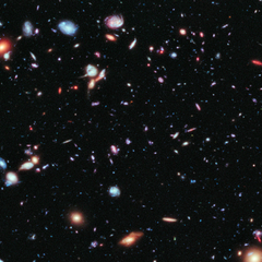 Image of our galaxy, showing colourful and distant planets and stars