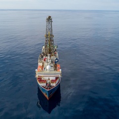 Photo of an ocean drilling ship at sea