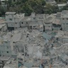 Image showing people standing amid the rubble of destroyed building