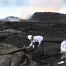 Image of Dr Penny Wieser sampling the Kilauea lavas
