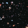 Image of our galaxy, showing colourful and distant planets and stars