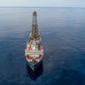 Photo of an ocean drilling ship at sea