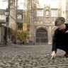 Photo of Professor Holness pointing down at cobbles