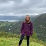 Photo of Natalie Forrest with green hills behind
