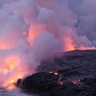 Image of lava flows in Iceland meeting the sea, with incandescent steam lofting