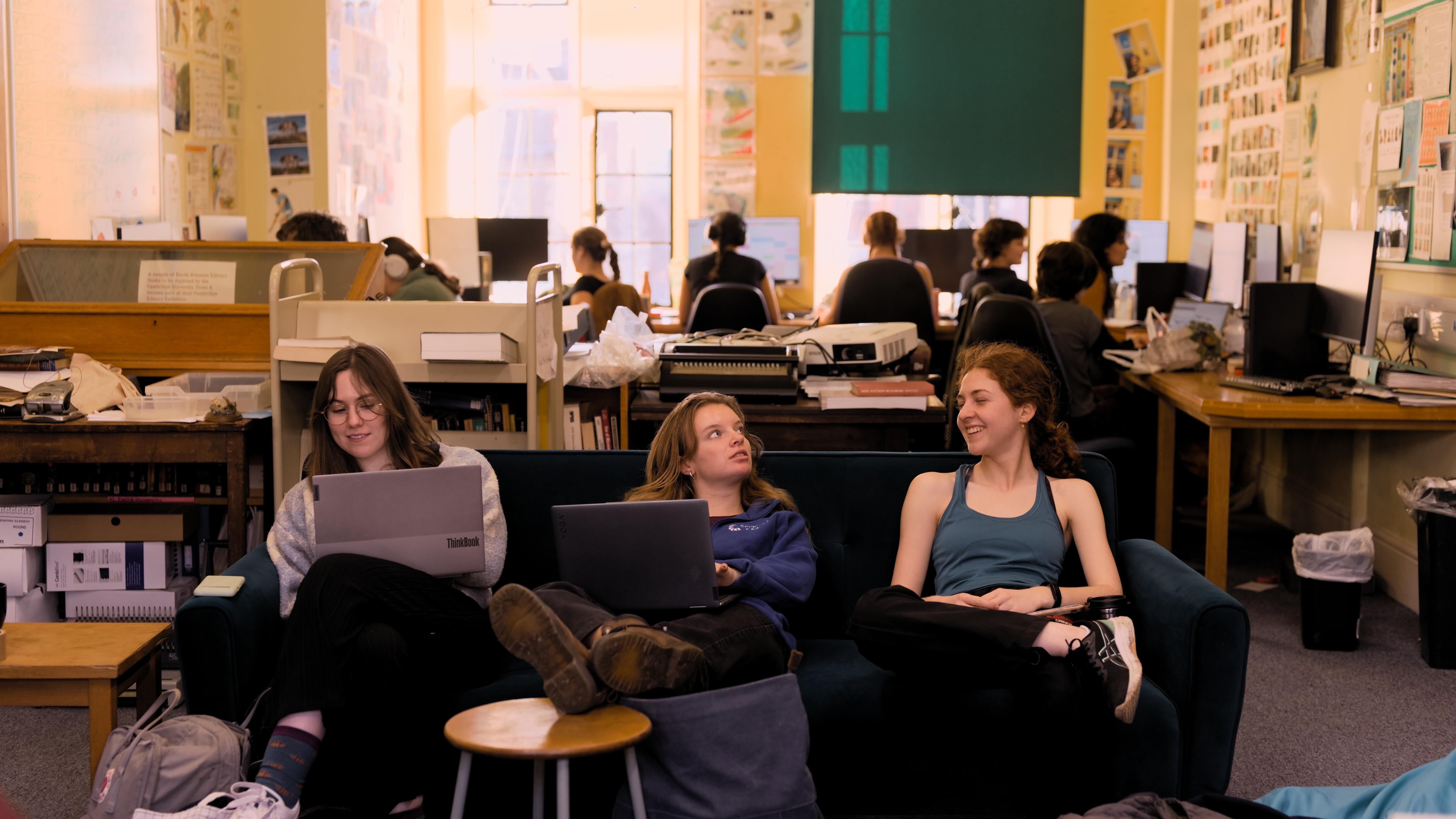 The good replacement picture A picture of three students on the sofa in the Earth Sciences Library, with others working on computers in the background. On a bright winter's day.