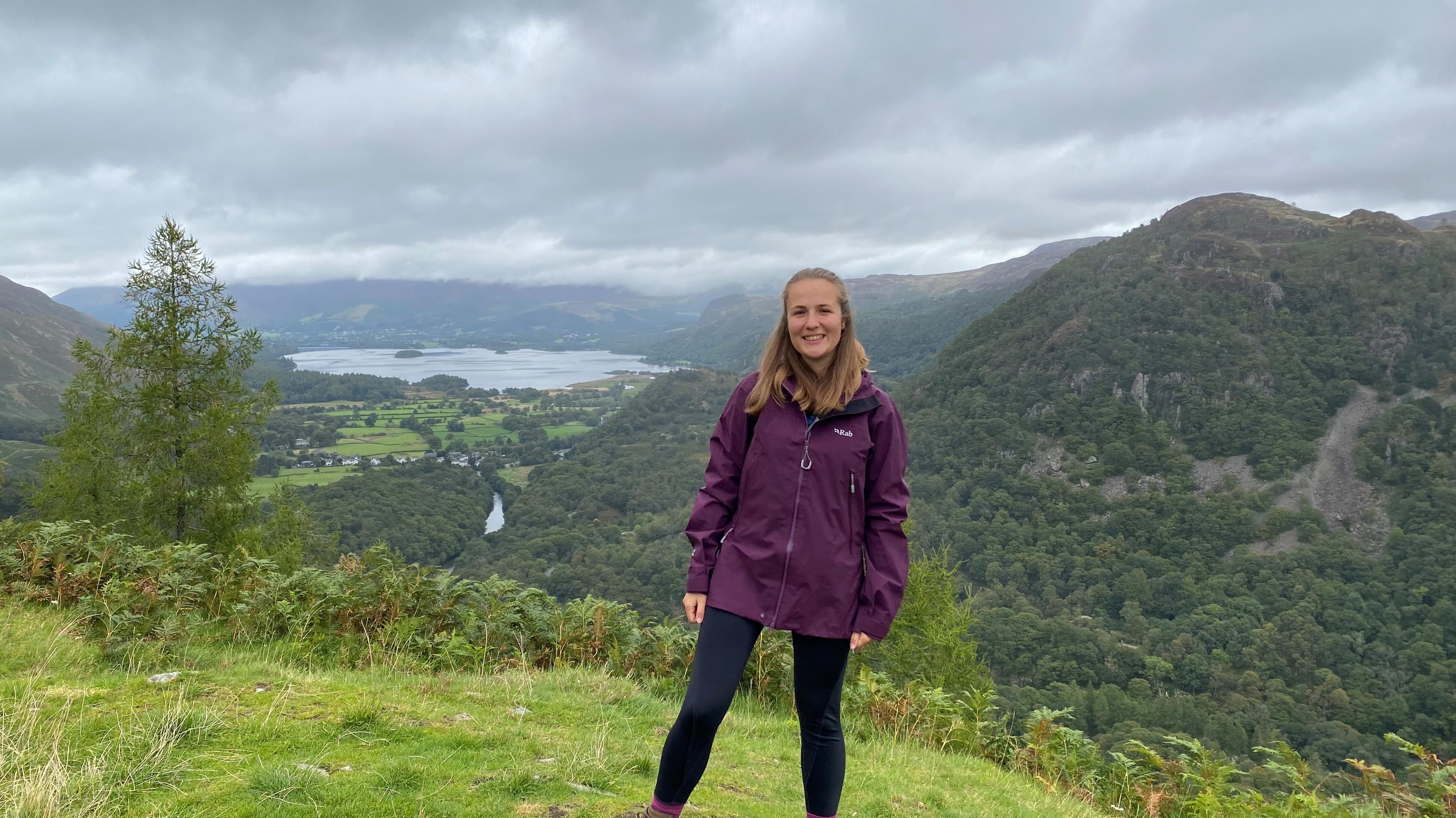 Photo of Natalie Forrest with green hills behind