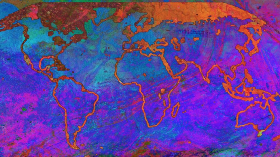 Abstract image showing a map of the world in blue/pink printed inks