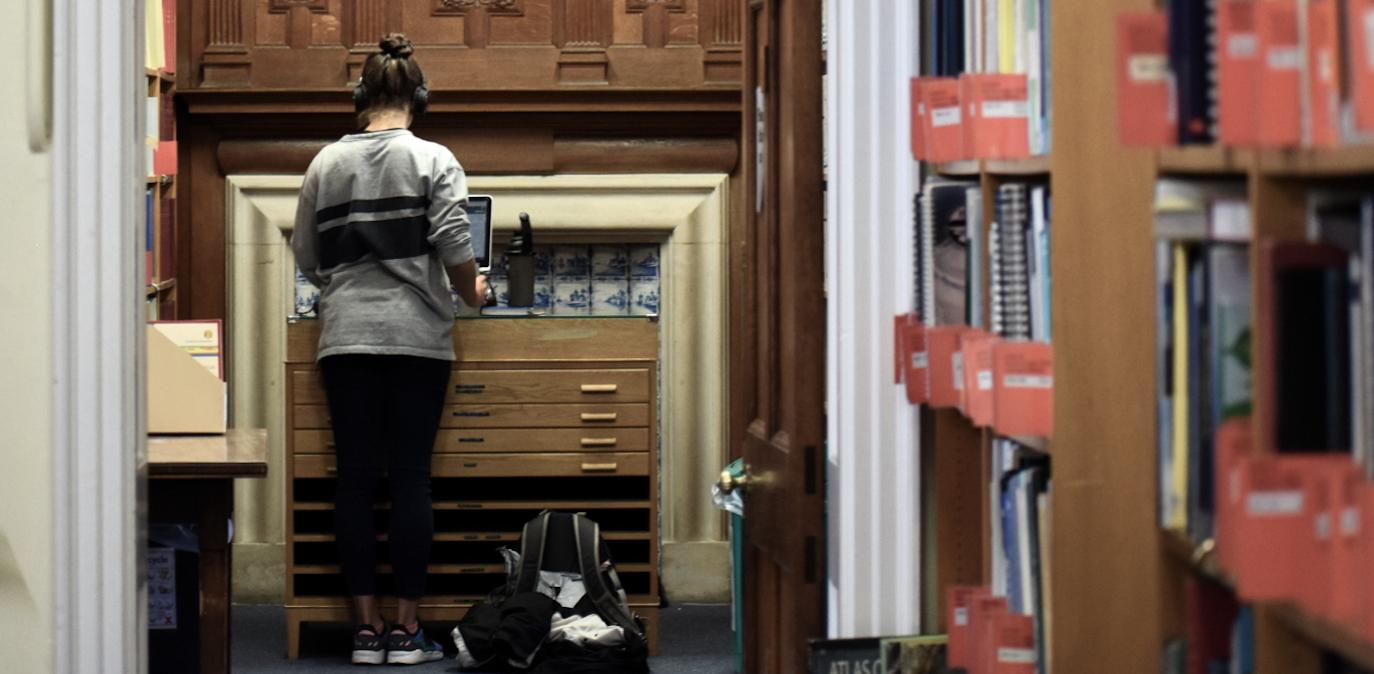 Map chest doubles as a standing desk in the library
