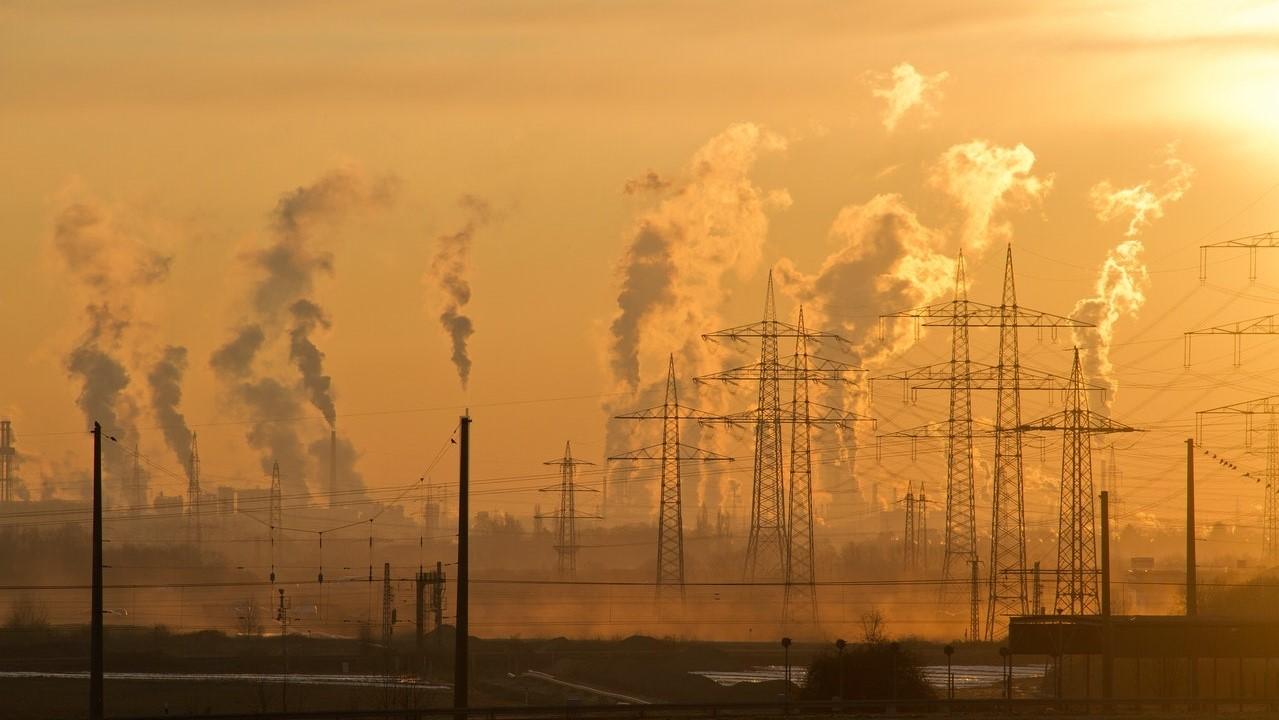 Image of sunset with smoke emitted from power stations