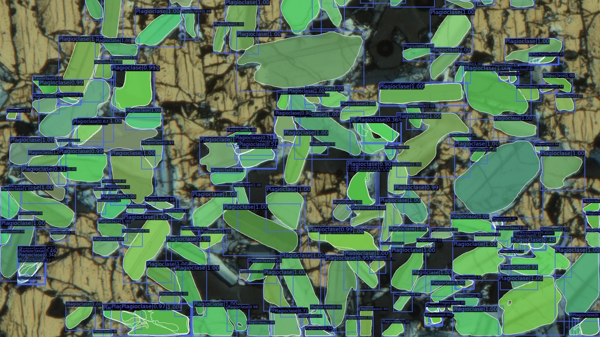 Microphotograph showing green envelopes drawn over plagioclase crystals