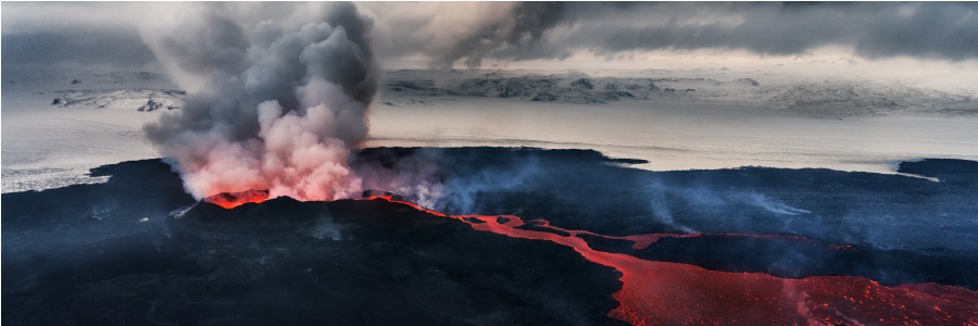 The Bárðarbunga-Holuhraun eruption in action Image showing ash spewing out of a volcano, with ice covered landscape behind and incandescent lava flow in the foreground