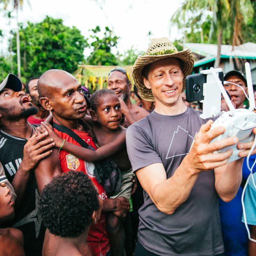 Photo of man showing community how to fly drone