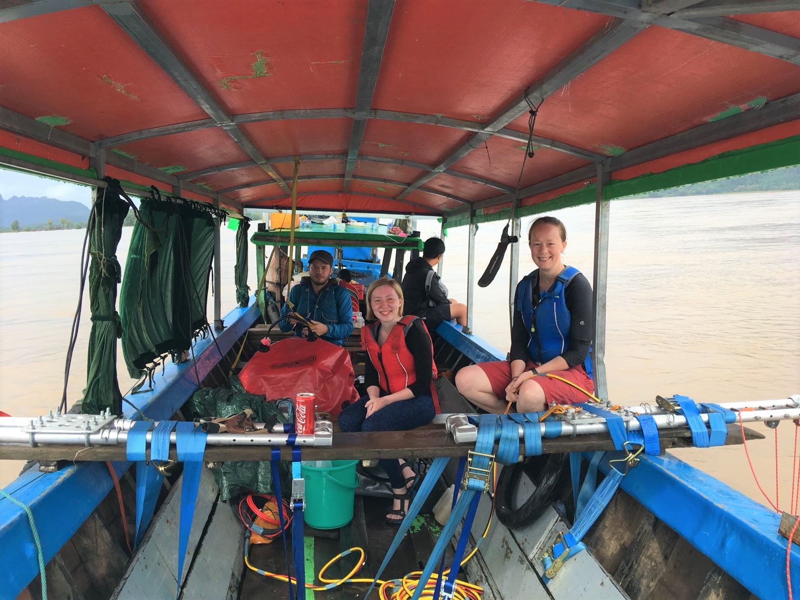 Image of Emily, Christina and Jotis on a boat sampling the Salween River