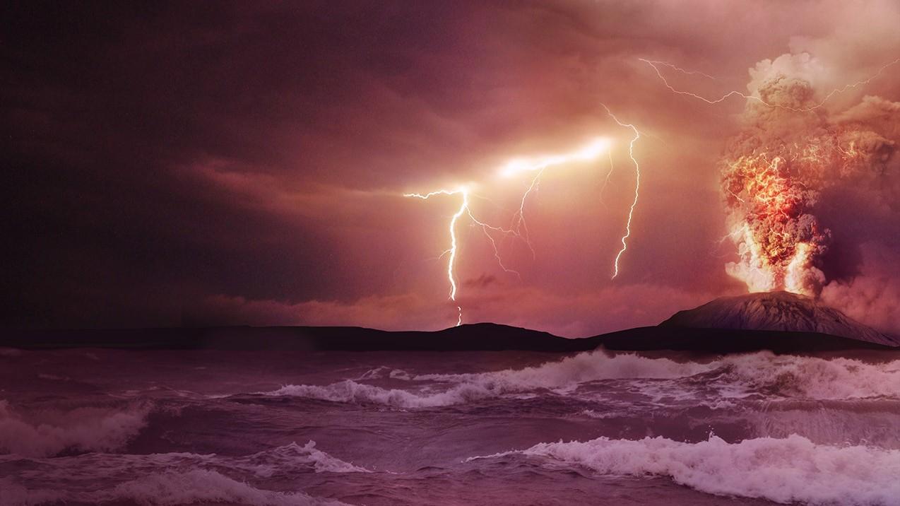 Photo of volcanic eruption with lightning and stormy sea in foreground